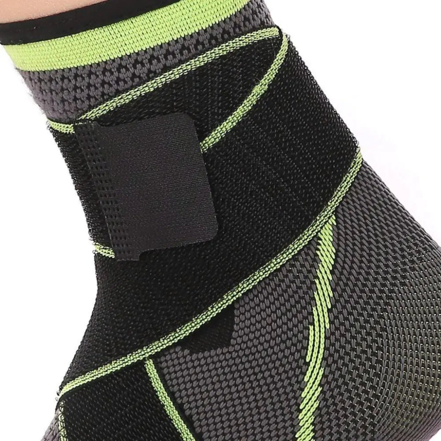 Black and green ankle support brace on a white background